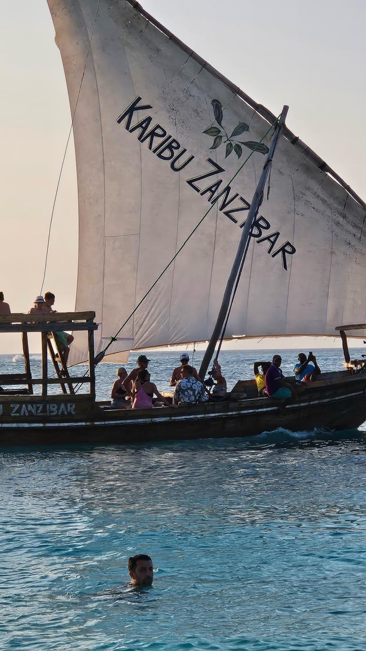 Dhow Cruises: Enjoy traditional sailing at sunset at Kendwa Rock Beach